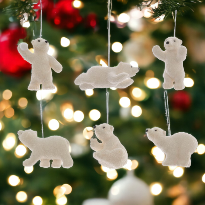 polar bear tree decorations on a blurred tree and led background