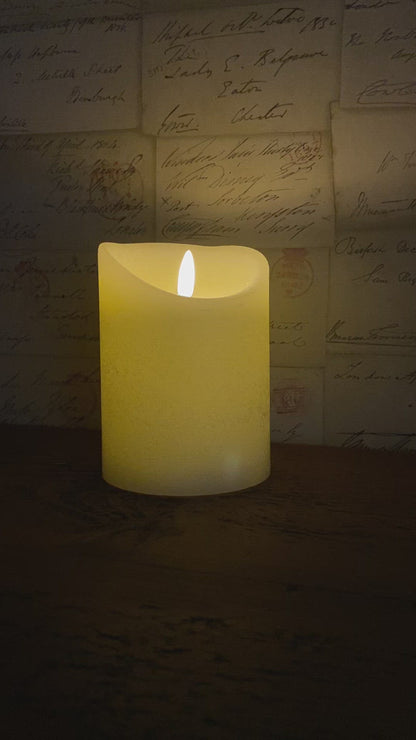 video of the cream led candle with it's flickering flame wick.