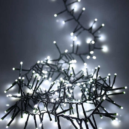 light set with the lights clumped into a pile lit and one strand pulled out to show them