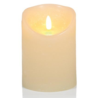 cream led candle on a plain white background