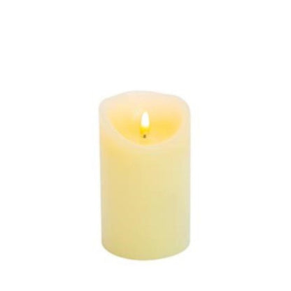 cream candle with the LED on, with a plain white background